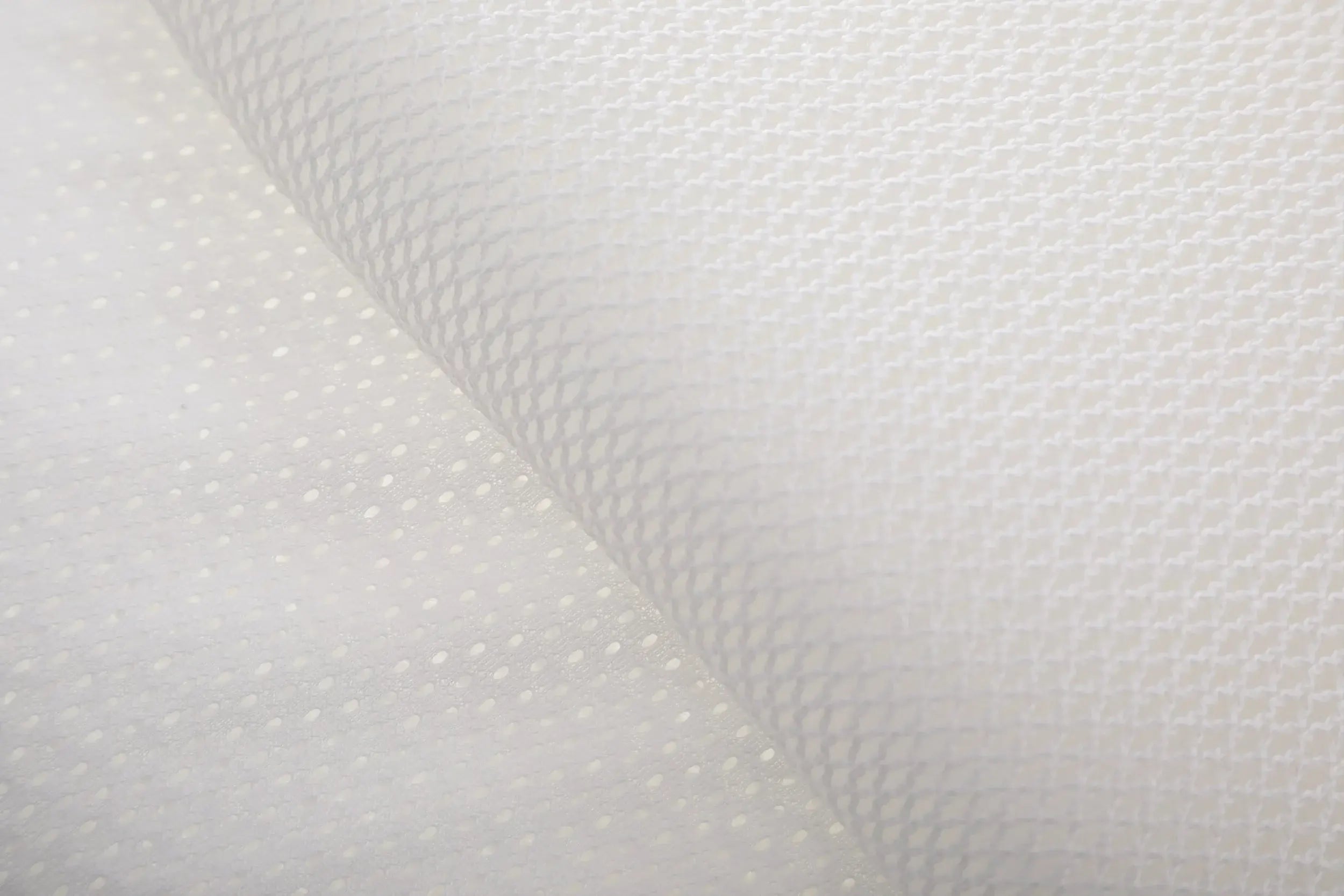 Close up of the materials used in the SleepSure™ Anti-Suffocation pillow.