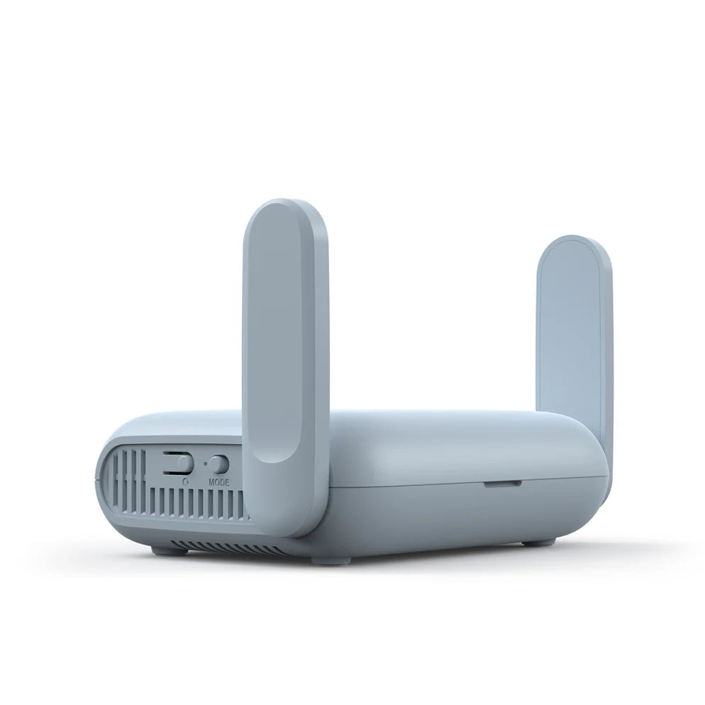 Gray router with antennas on a white background